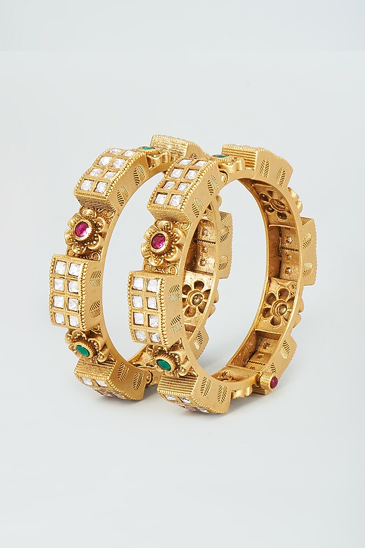 Gold Finish Kundan Polki & Multi-Colored Stone Temple Bangles (Set Of 2) by VASTRAA Jewellery at Pernia's Pop Up Shop