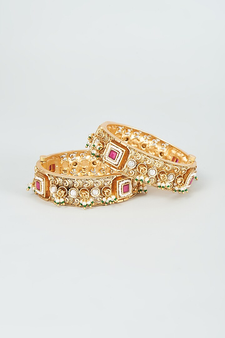 Gold Finish Kundan Polki & Red Stone Temple Bangles (Set Of 2) by VASTRAA Jewellery at Pernia's Pop Up Shop