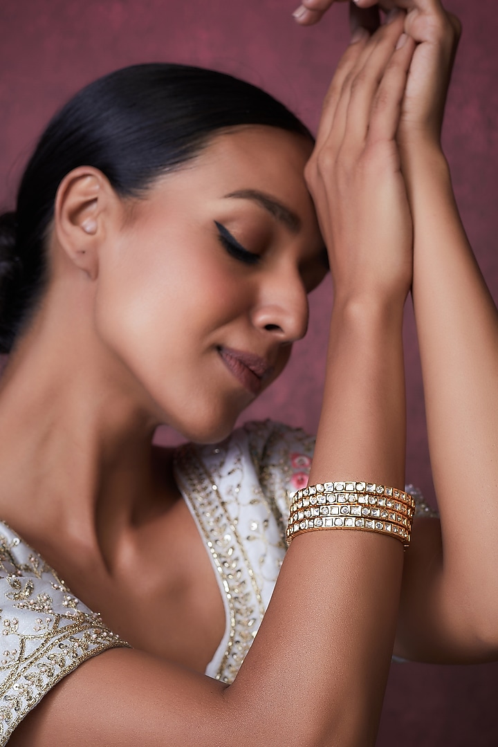 Gold Finish Kundan Polki Bangles (Set of 4) by VASTRAA Jewellery at Pernia's Pop Up Shop