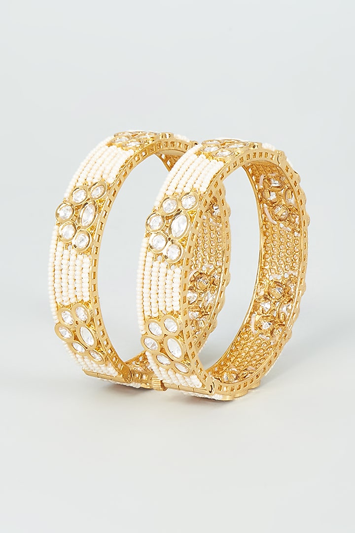 Gold Finish Kundan Polki & Pearl Bangles (Set Of 2) by VASTRAA Jewellery at Pernia's Pop Up Shop