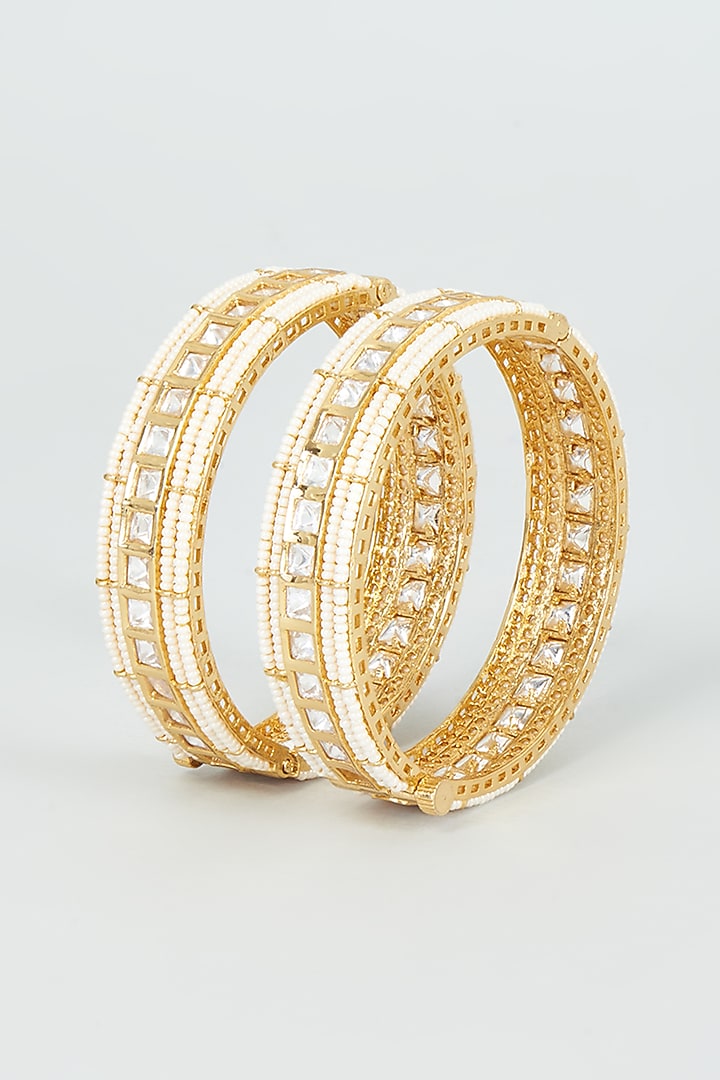 Gold Finish Kundan Polki & Pearl Temple Bangles (Set Of 2) by VASTRAA Jewellery at Pernia's Pop Up Shop