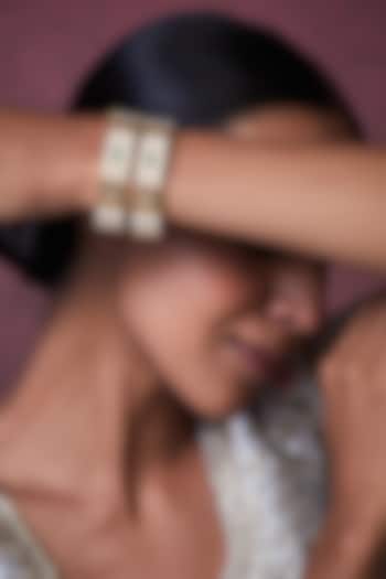 Gold Finish Kundan Polki & Pearl Bangles (Set of 2) by VASTRAA Jewellery at Pernia's Pop Up Shop