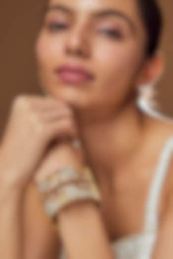 Gold Finish Kundan Polki & Pearl Bangles (Set of 2) by VASTRAA Jewellery at Pernia's Pop Up Shop