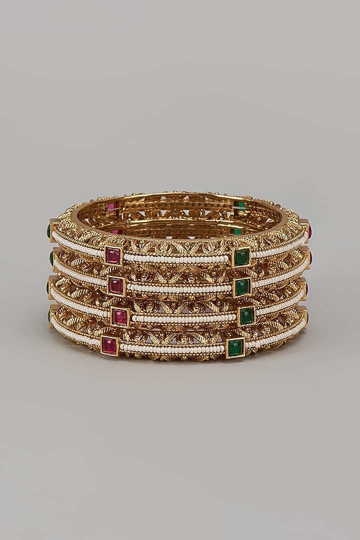 Gold Finish Kundan Polki & Multi-Colored Stone Temple Bangles (Set Of 4) by VASTRAA Jewellery at Pernia's Pop Up Shop