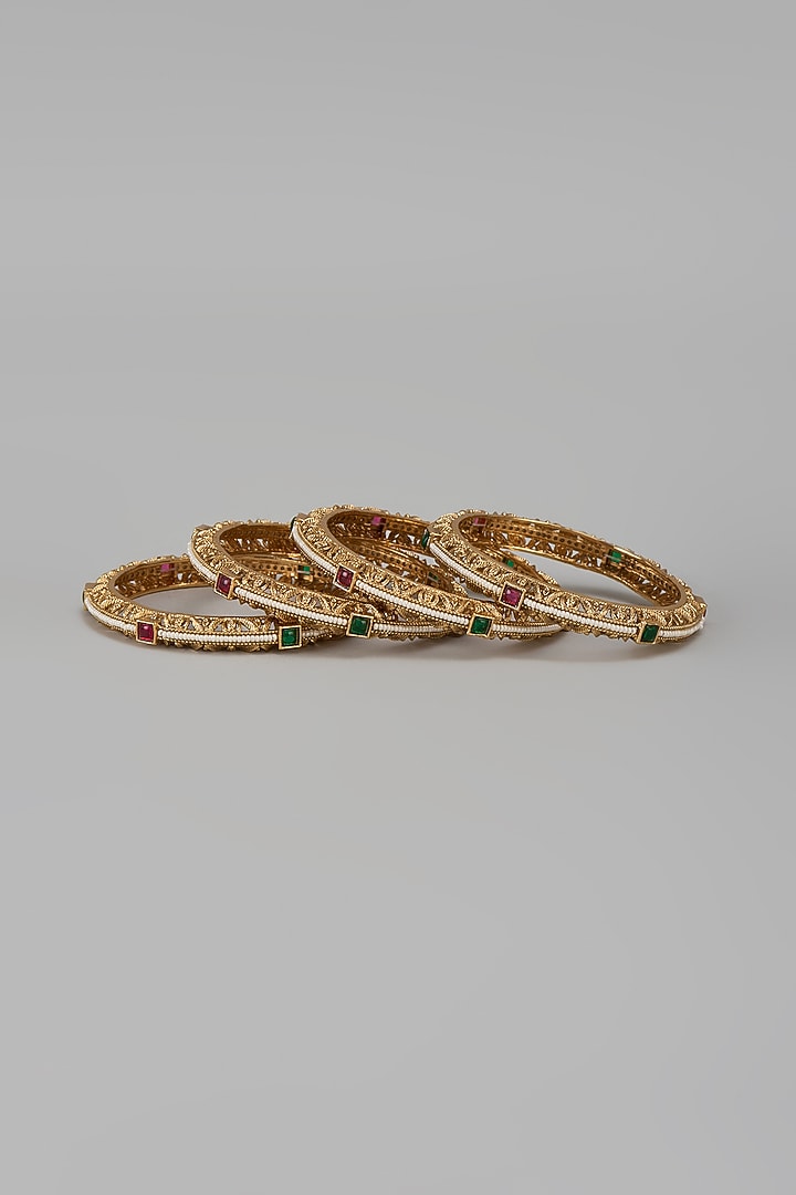 Gold Finish Kundan Polki & Multi-Colored Stone Temple Bangles (Set Of 4) by VASTRAA Jewellery at Pernia's Pop Up Shop