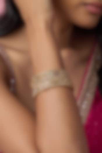 Gold Finish Kundan Polki & Multi-Colored Stone Temple Bangles (Set Of 2) by VASTRAA Jewellery at Pernia's Pop Up Shop