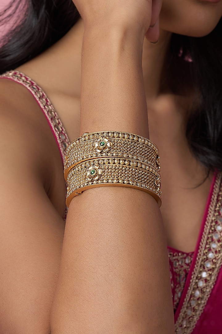 Gold Finish Kundan Polki & Multi-Colored Stone Temple Bangles (Set Of 2) by VASTRAA Jewellery at Pernia's Pop Up Shop