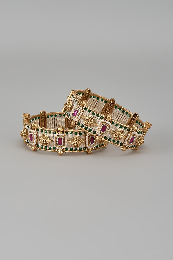 Gold Finish Kundan Polki & Multi-Colored Stone Temple Bangles (Set Of 2) by VASTRAA Jewellery at Pernia's Pop Up Shop