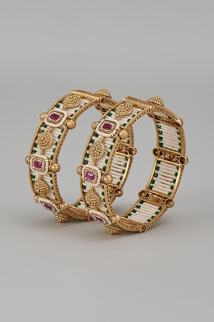 Gold Finish Kundan Polki & Multi-Colored Stone Temple Bangles (Set Of 2) by VASTRAA Jewellery at Pernia's Pop Up Shop