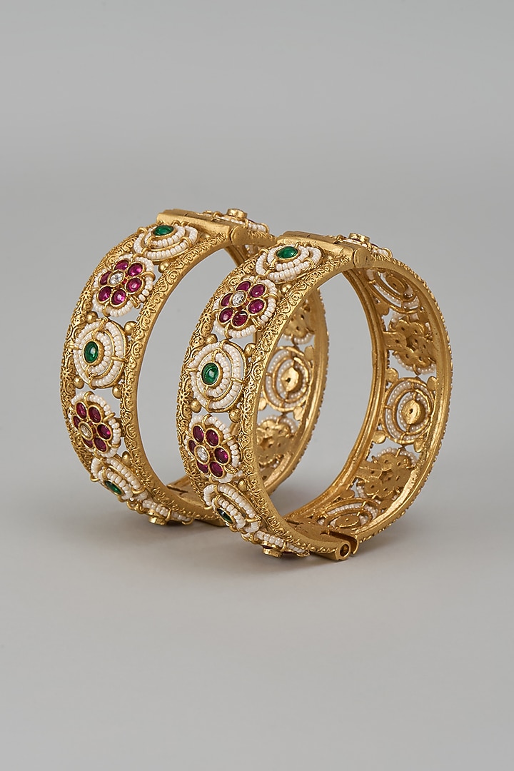 Gold Finish Kundan Polki & Multi-Colored Stone Temple Bangles (Set Of 2) by VASTRAA Jewellery at Pernia's Pop Up Shop