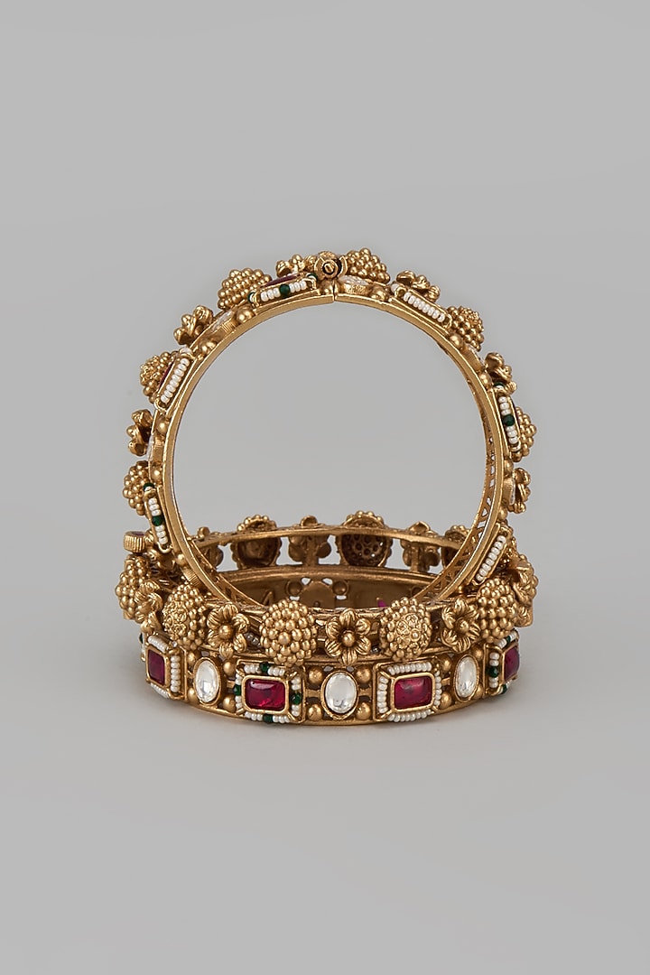 Gold Finish Kundan Polki & Red Stone Temple Bangles (Set Of 2) by VASTRAA Jewellery at Pernia's Pop Up Shop