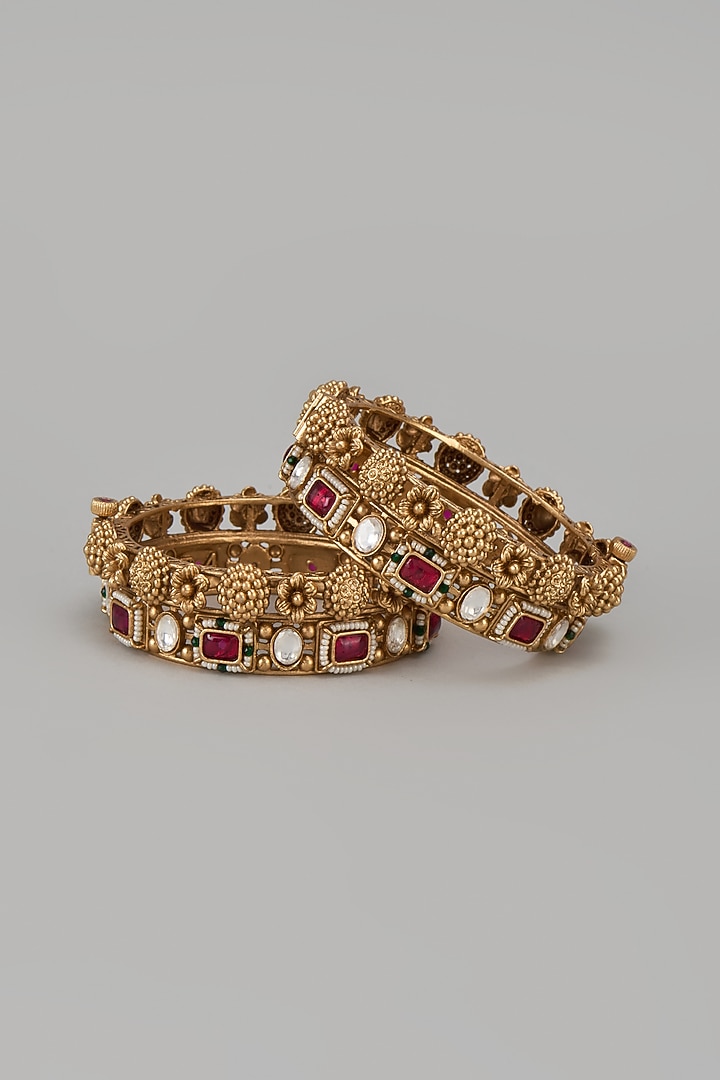 Gold Finish Kundan Polki & Red Stone Temple Bangles (Set Of 2) by VASTRAA Jewellery at Pernia's Pop Up Shop