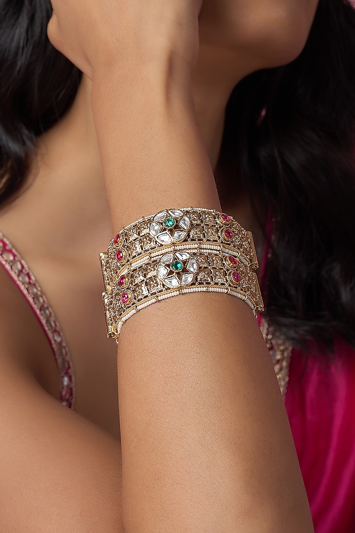 Gold Finish Kundan Polki & Multi-Colored Stone Temple Bangles (Set Of 2) by VASTRAA Jewellery at Pernia's Pop Up Shop