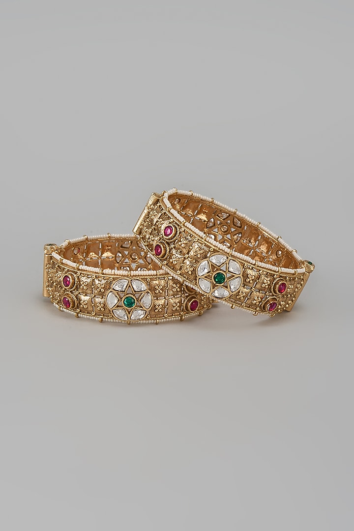Gold Finish Kundan Polki & Multi-Colored Stone Temple Bangles (Set Of 2) by VASTRAA Jewellery at Pernia's Pop Up Shop