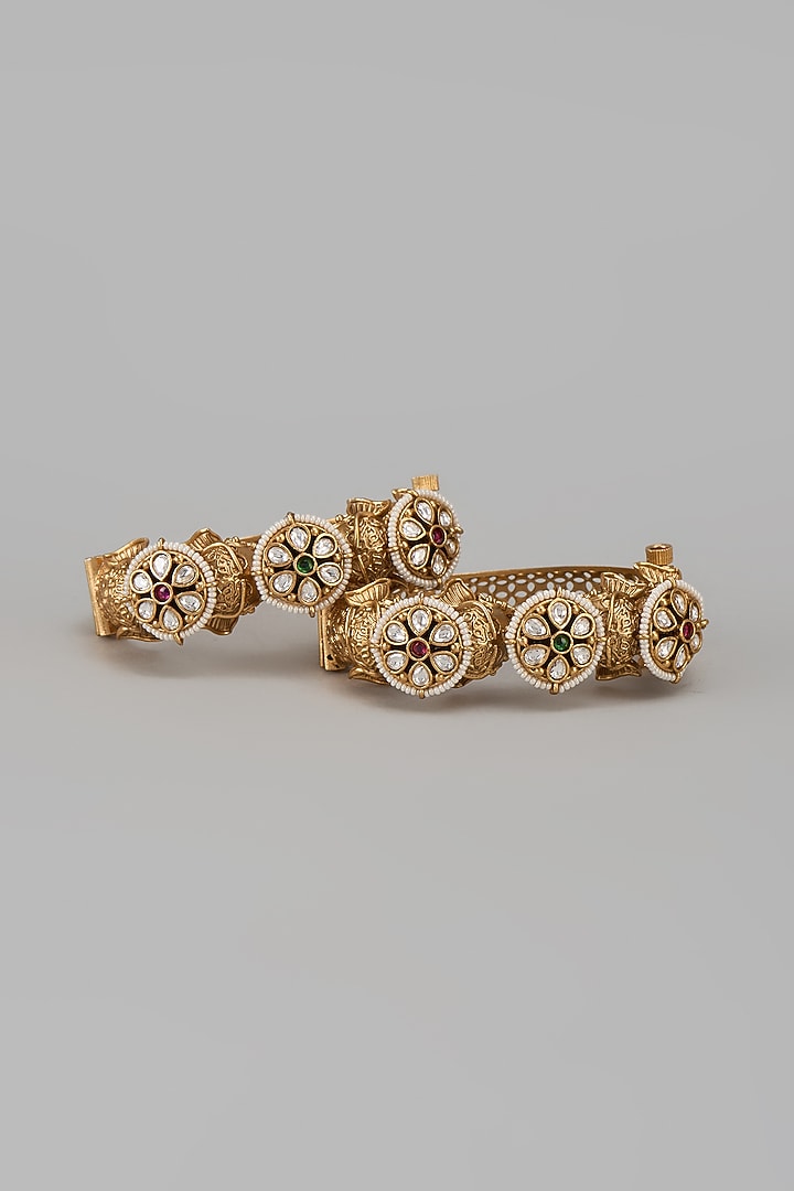 Gold Finish Kundan Polki & Multi-Colored Stone Temple Bangles (Set Of 2) by VASTRAA Jewellery at Pernia's Pop Up Shop