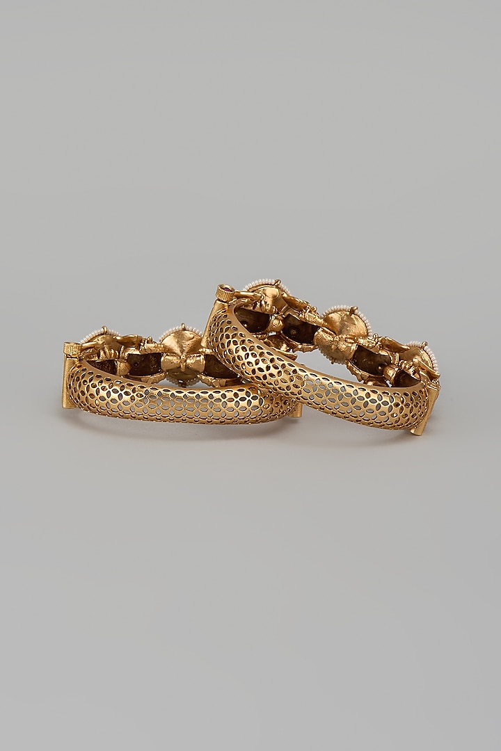 Gold Finish Kundan Polki & Multi-Colored Stone Temple Bangles (Set Of 2) by VASTRAA Jewellery at Pernia's Pop Up Shop