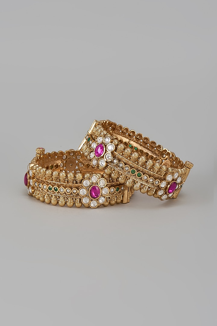 Gold Finish Kundan Polki & Red Stone Temple Bangles (Set Of 2) by VASTRAA Jewellery at Pernia's Pop Up Shop