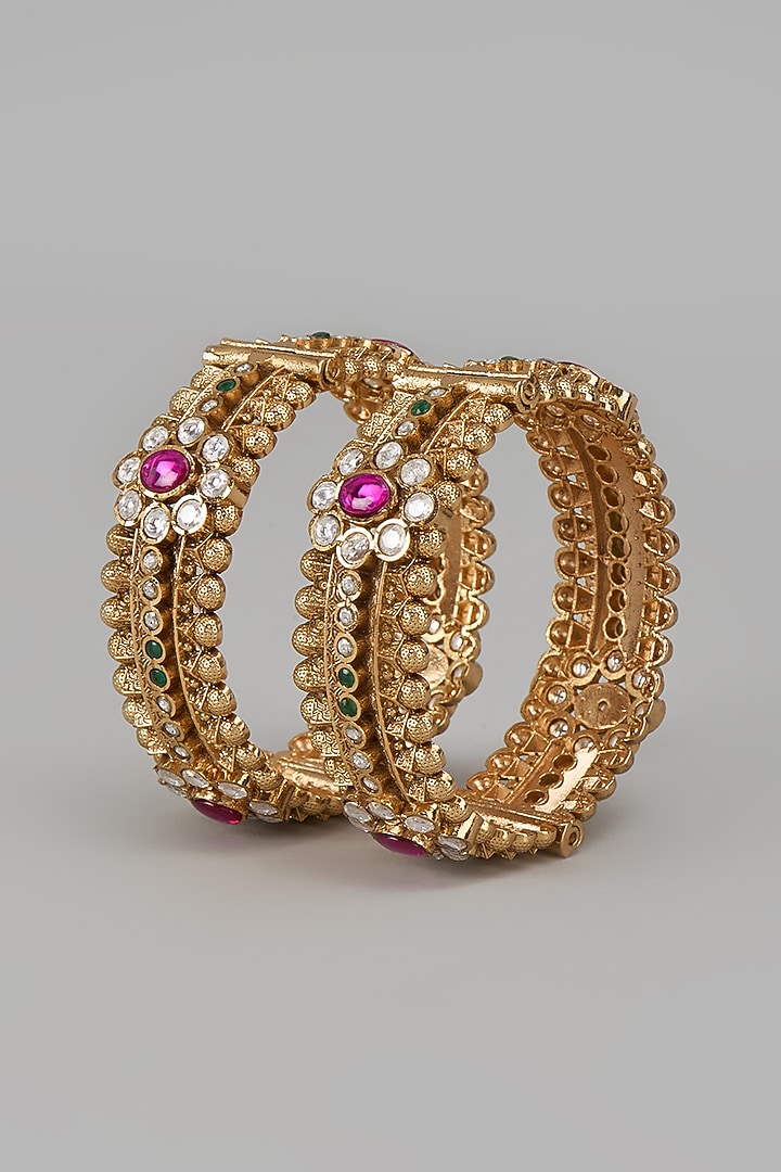 Gold Finish Kundan Polki & Red Stone Temple Bangles (Set Of 2) by VASTRAA Jewellery at Pernia's Pop Up Shop