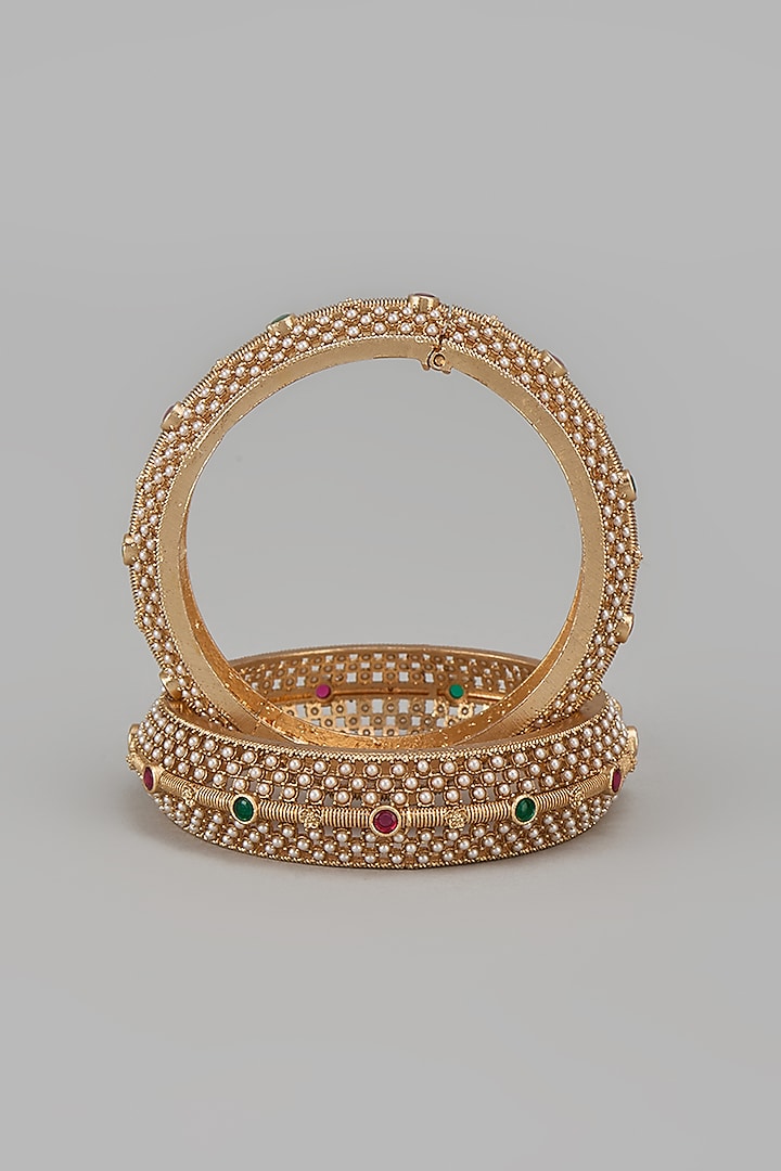 Gold Finish Kundan Polki & Multi-Colored Stone Temple Bangles (Set Of 2) by VASTRAA Jewellery at Pernia's Pop Up Shop