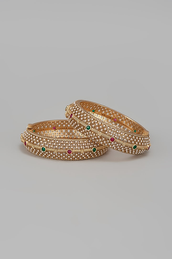 Gold Finish Kundan Polki & Multi-Colored Stone Temple Bangles (Set Of 2) by VASTRAA Jewellery at Pernia's Pop Up Shop