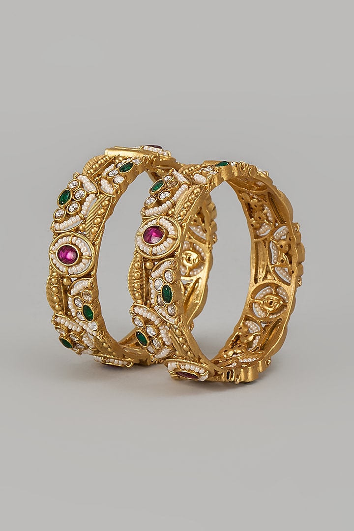 Gold Finish Kundan Polki & Multi-Colored Stone Temple Bangles (Set Of 2) by VASTRAA Jewellery at Pernia's Pop Up Shop
