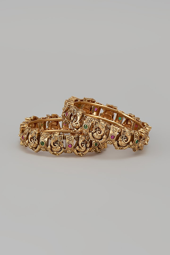 Gold Finish Kundan Polki & Synthetic Stone Temple Bangles (Set Of 2) by VASTRAA Jewellery at Pernia's Pop Up Shop