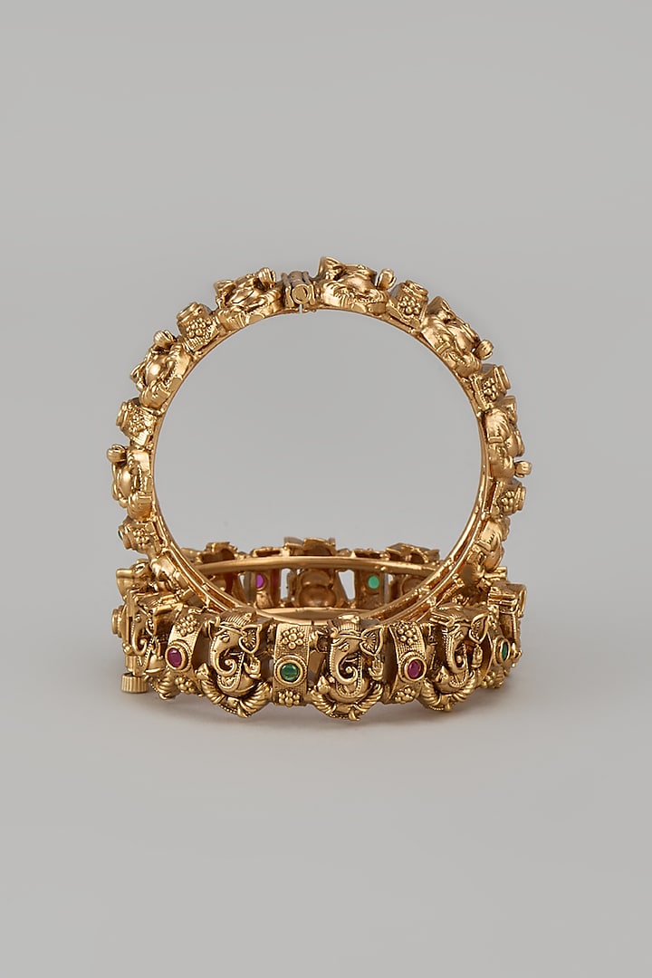 Gold Finish Kundan Polki & Synthetic Stone Temple Bangles (Set Of 2) by VASTRAA Jewellery at Pernia's Pop Up Shop