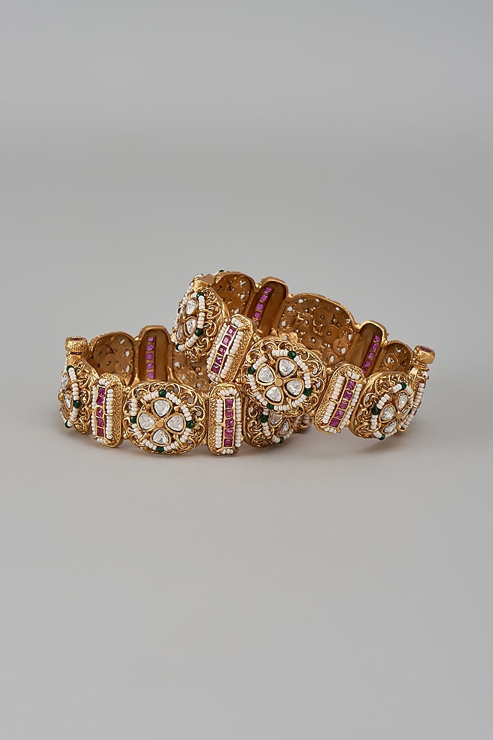 Gold Finish Kundan Polki & Multi-Colored Stone Temple Bangles (Set Of 2) by VASTRAA Jewellery at Pernia's Pop Up Shop