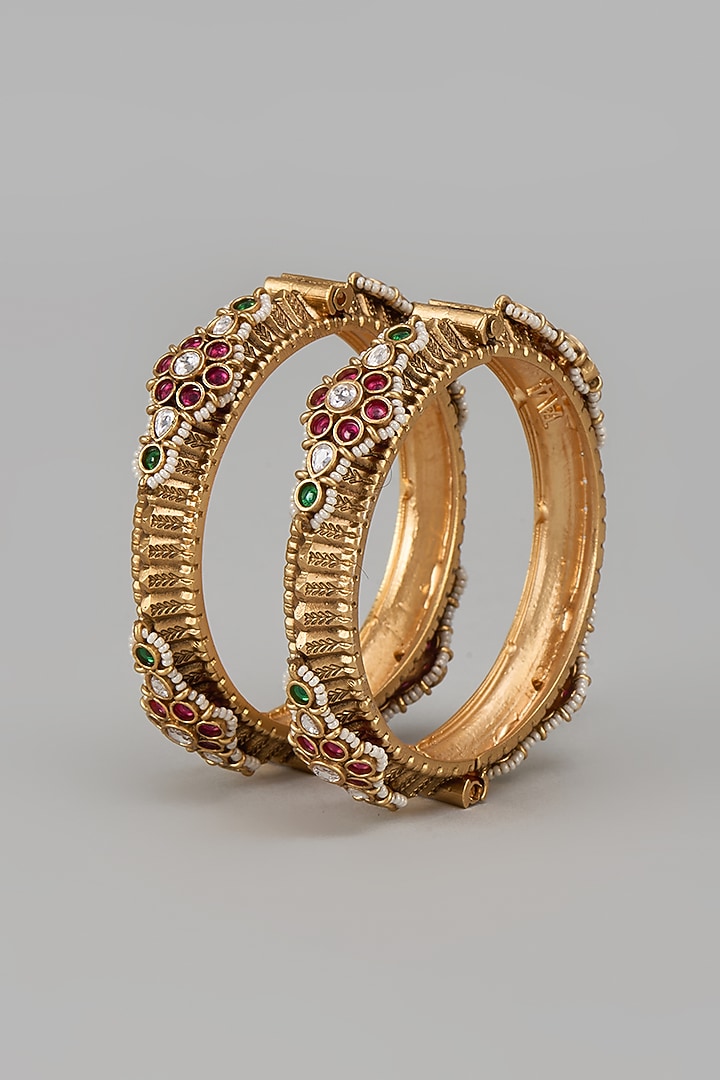 Gold Finish Kundan Polki & Multi-Colored Stone Temple Bangles (Set Of 2) by VASTRAA Jewellery at Pernia's Pop Up Shop