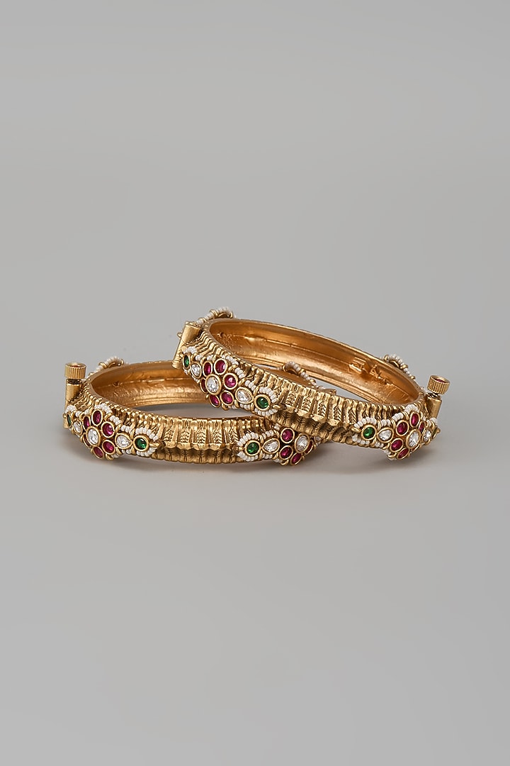 Gold Finish Kundan Polki & Multi-Colored Stone Temple Bangles (Set Of 2) by VASTRAA Jewellery at Pernia's Pop Up Shop