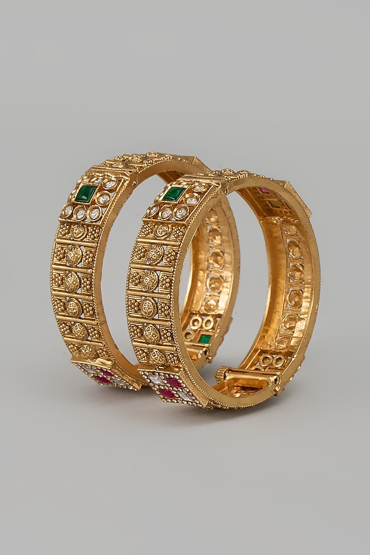 Gold Finish Kundan Polki & Red Stone Temple Bangles (Set Of 2) by VASTRAA Jewellery at Pernia's Pop Up Shop