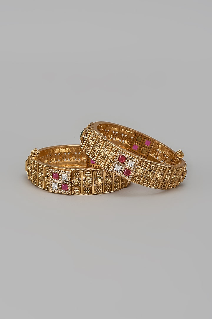 Gold Finish Kundan Polki & Red Stone Temple Bangles (Set Of 2) by VASTRAA Jewellery at Pernia's Pop Up Shop