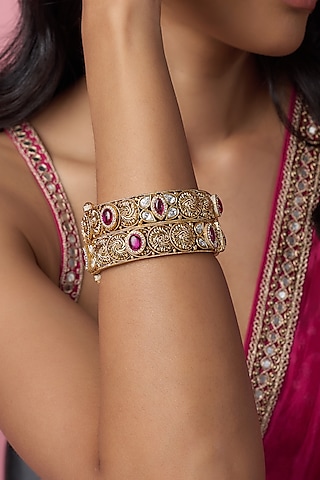 Gold Finish Kundan Polki & Red Stone Temple Bangles (Set Of 2) by VASTRAA Jewellery