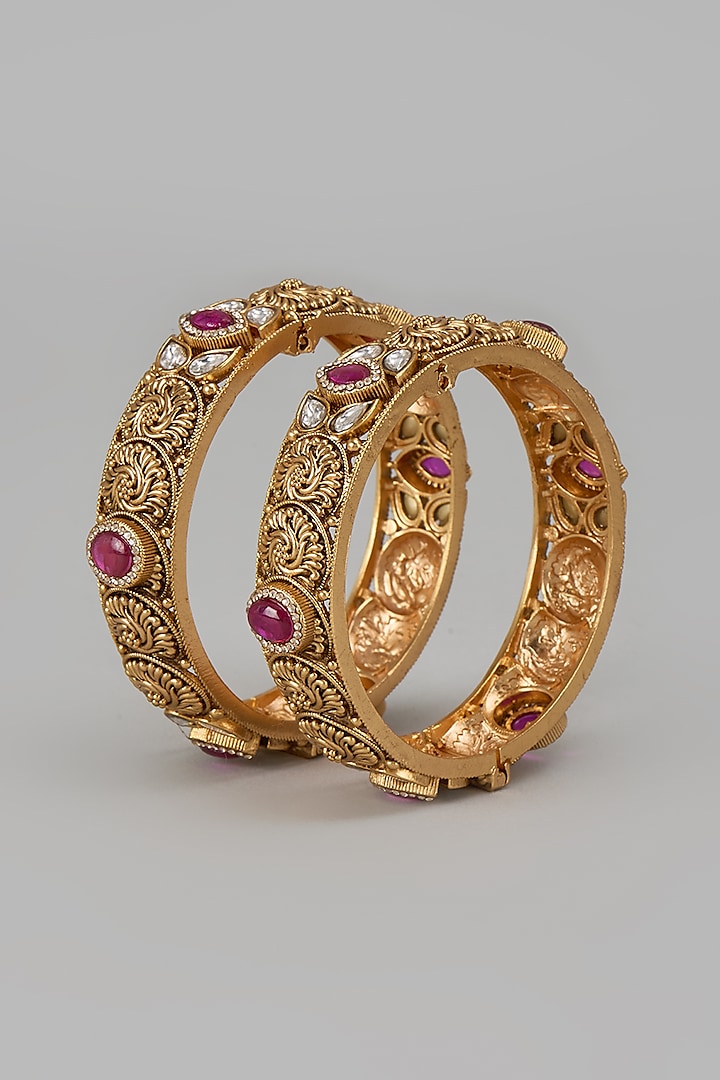 Gold Finish Kundan Polki & Red Stone Temple Bangles (Set Of 2) by VASTRAA Jewellery at Pernia's Pop Up Shop