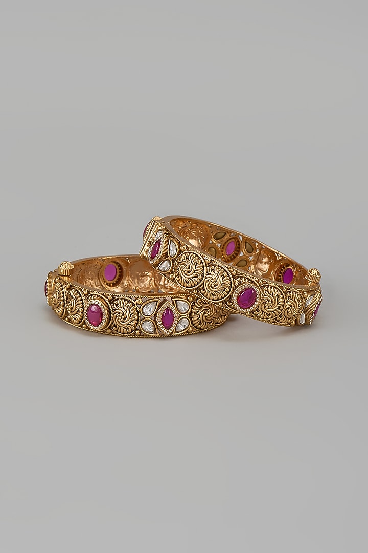 Gold Finish Kundan Polki & Red Stone Temple Bangles (Set Of 2) by VASTRAA Jewellery at Pernia's Pop Up Shop