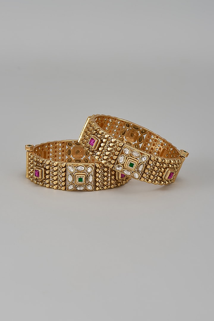 Gold Finish Kundan Polki & Multi-Colored Stone Temple Bangles (Set Of 2) by VASTRAA Jewellery at Pernia's Pop Up Shop