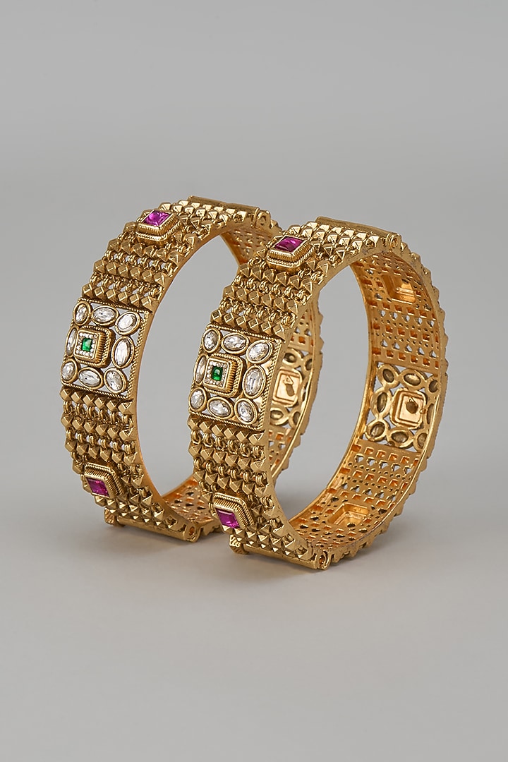 Gold Finish Kundan Polki & Multi-Colored Stone Temple Bangles (Set Of 2) by VASTRAA Jewellery at Pernia's Pop Up Shop