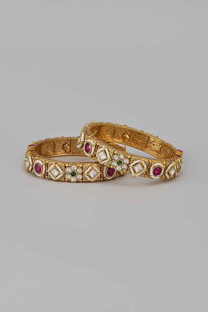 Gold Finish Kundan Polki & Multi-Colored Stone Temple Bangles (Set Of 2) by VASTRAA Jewellery at Pernia's Pop Up Shop