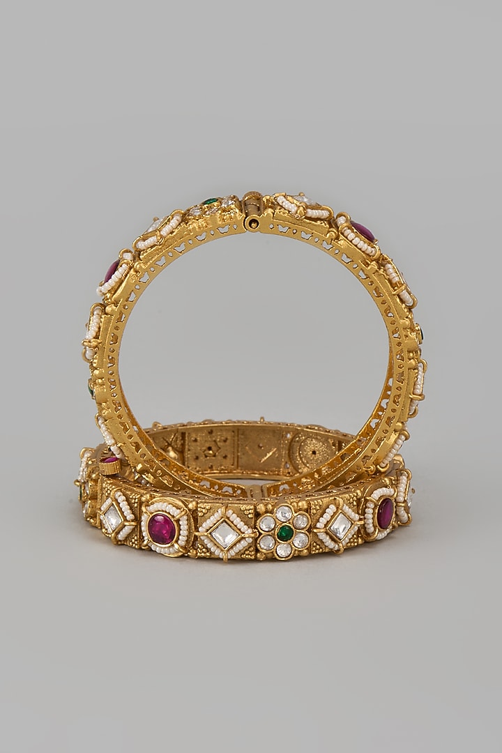 Gold Finish Kundan Polki & Multi-Colored Stone Temple Bangles (Set Of 2) by VASTRAA Jewellery at Pernia's Pop Up Shop