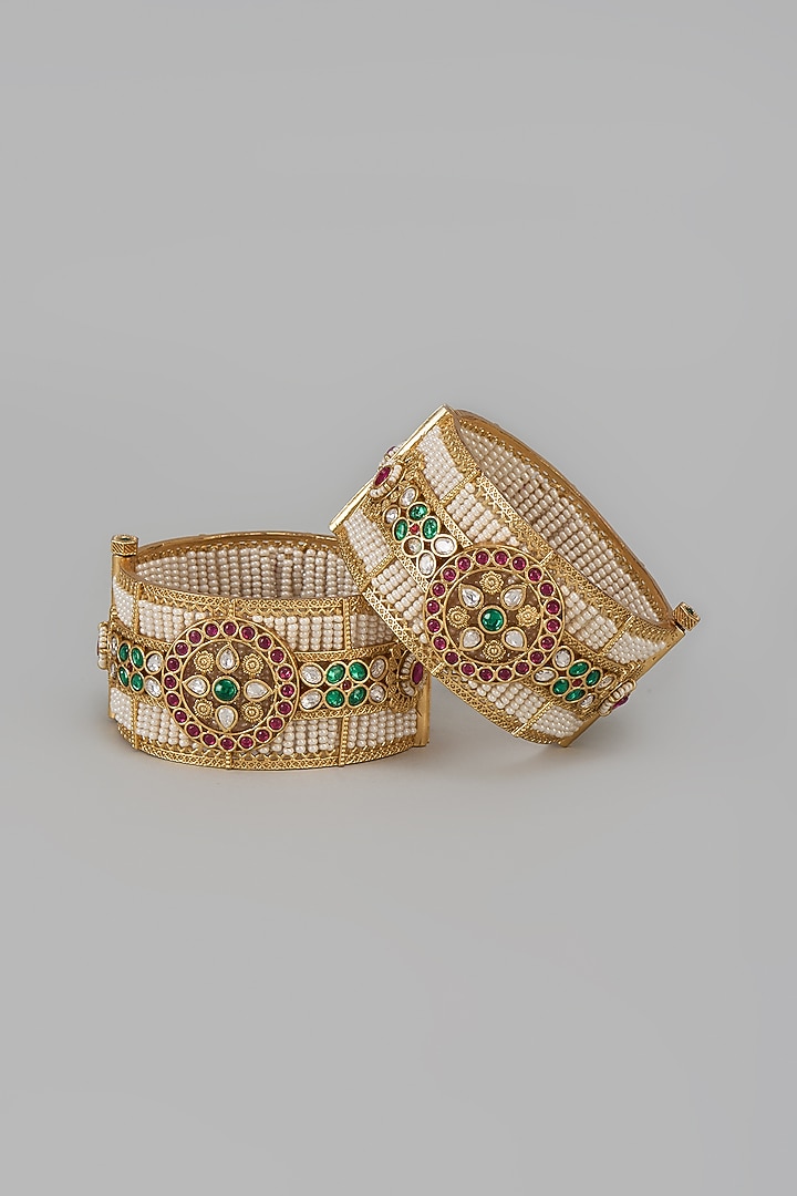 Gold Finish Kundan Polki & Multi-Colored Stone Temple Bangles (Set Of 2) by VASTRAA Jewellery at Pernia's Pop Up Shop