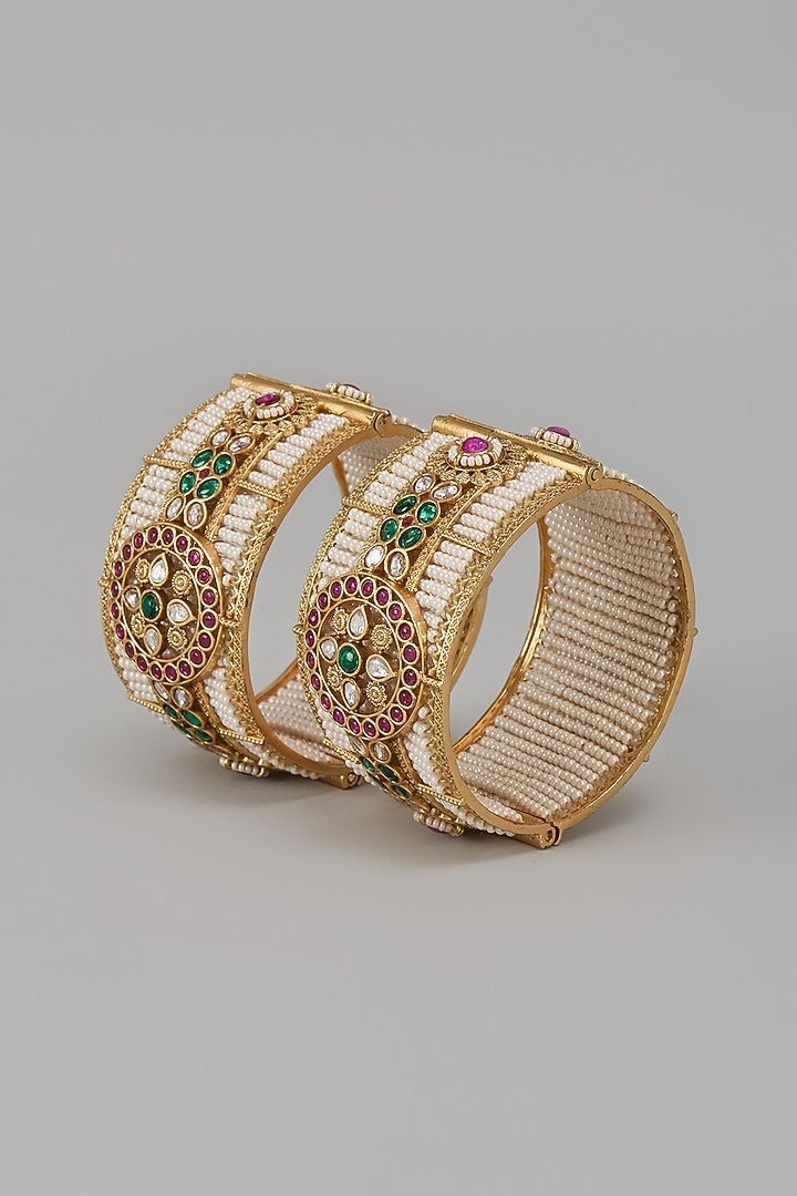 Gold Finish Kundan Polki & Multi-Colored Stone Temple Bangles (Set Of 2) by VASTRAA Jewellery at Pernia's Pop Up Shop