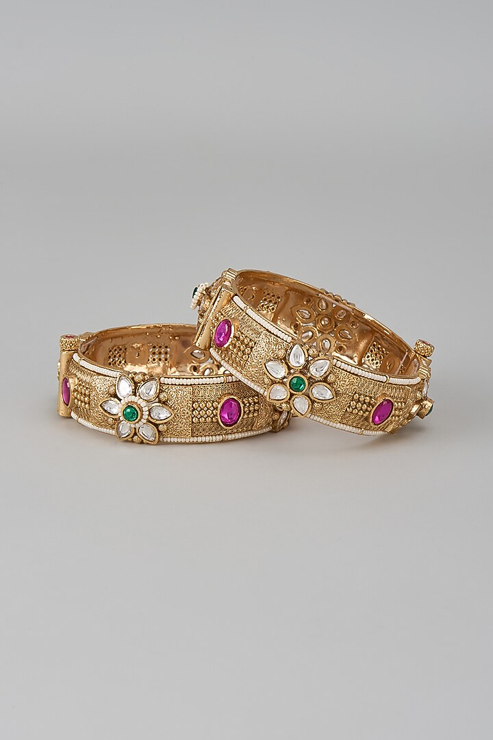 Gold Finish Kundan Polki & Multi-Colored Stone Temple Bangles (Set Of 2) by VASTRAA Jewellery at Pernia's Pop Up Shop