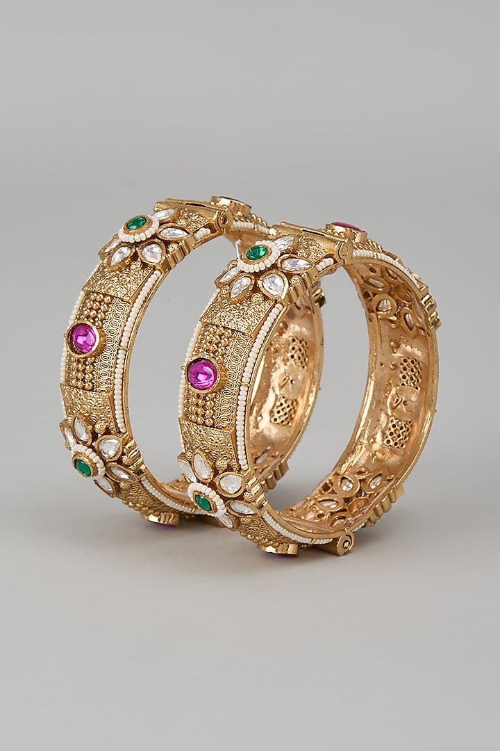 Gold Finish Kundan Polki & Multi-Colored Stone Temple Bangles (Set Of 2) by VASTRAA Jewellery at Pernia's Pop Up Shop