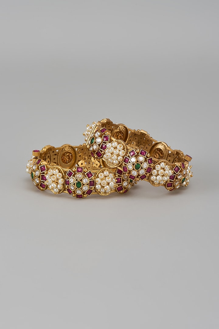 Gold Finish Kundan Polki & Multi-Colored Stone Temple Bangles (Set Of 2) by VASTRAA Jewellery at Pernia's Pop Up Shop