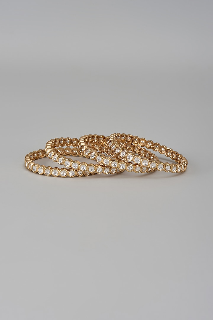 Gold Finish Kundan Polki Bangles (Set Of 4) by VASTRAA Jewellery at Pernia's Pop Up Shop