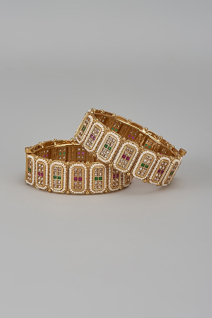 Gold Finish Kundan Polki & Multi-Colored Stone Temple Bangles (Set Of 2) by VASTRAA Jewellery at Pernia's Pop Up Shop