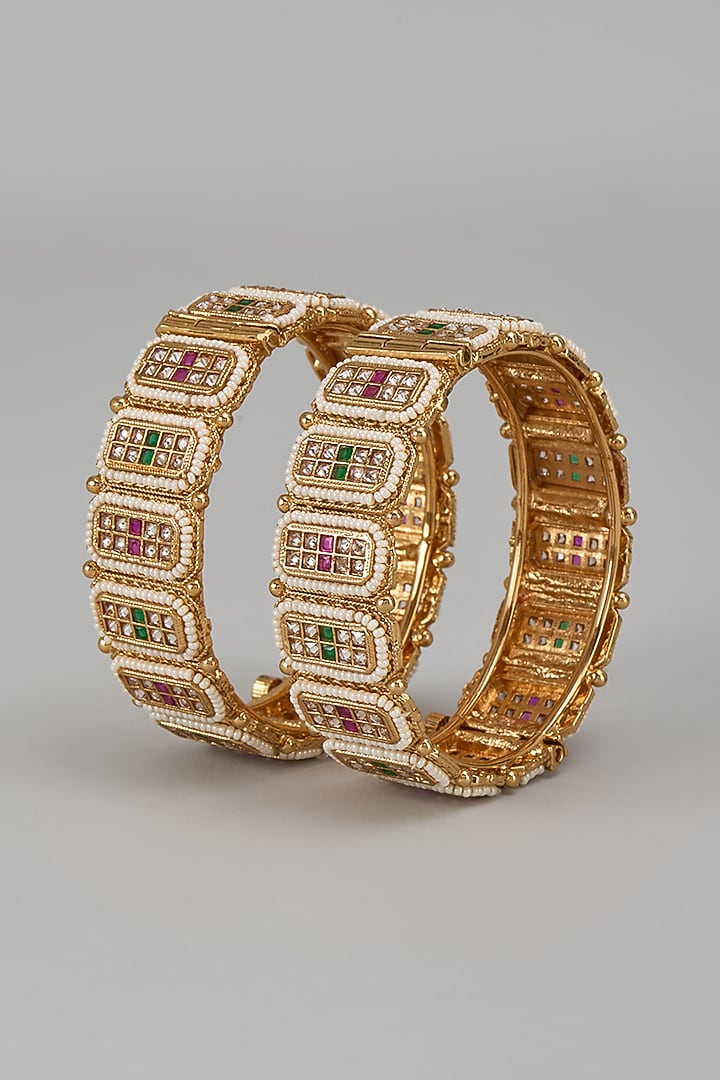 Gold Finish Kundan Polki & Multi-Colored Stone Temple Bangles (Set Of 2) by VASTRAA Jewellery at Pernia's Pop Up Shop