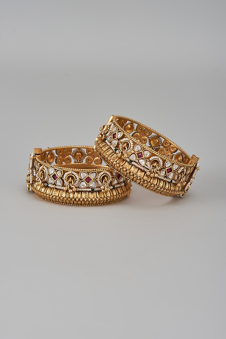 Gold Finish Kundan Polki & Multi-Colored Stone Temple Bangles (Set Of 2) by VASTRAA Jewellery at Pernia's Pop Up Shop