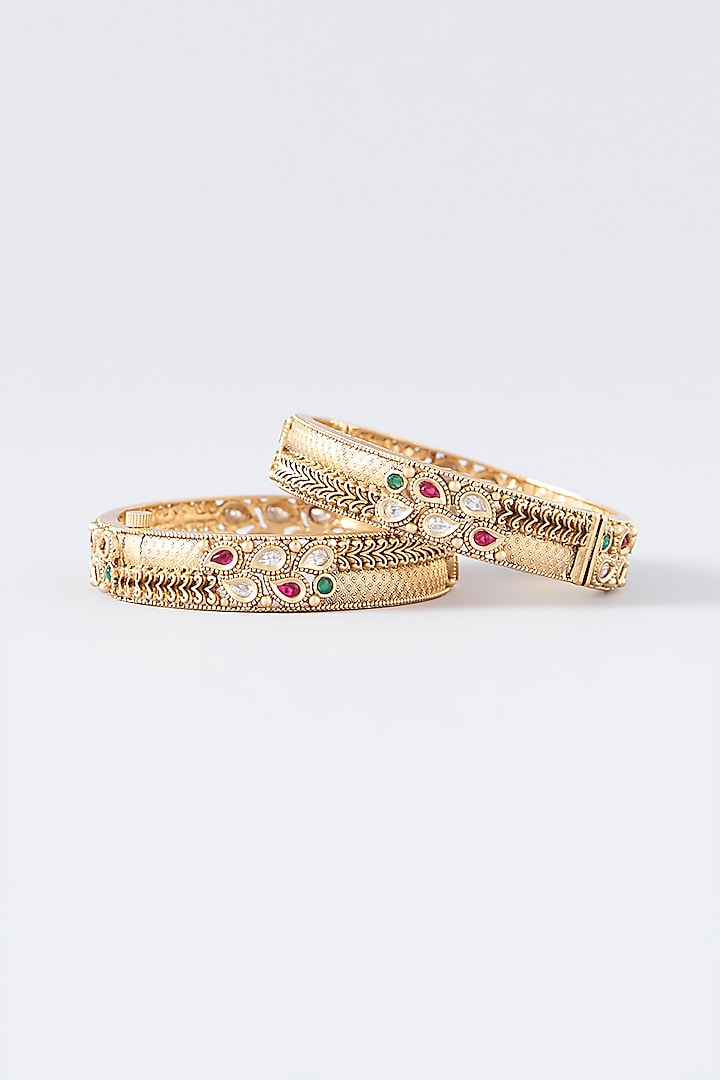 Gold Finish Kundan Polki & Multi-Colored Stone Temple Bangles (Set Of 2) by VASTRAA Jewellery at Pernia's Pop Up Shop