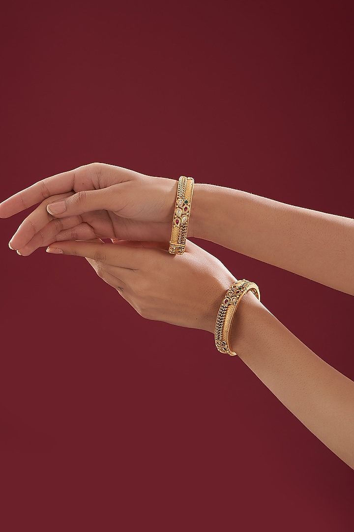 Gold Finish Kundan Polki & Multi-Colored Stone Temple Bangles (Set Of 2) by VASTRAA Jewellery at Pernia's Pop Up Shop